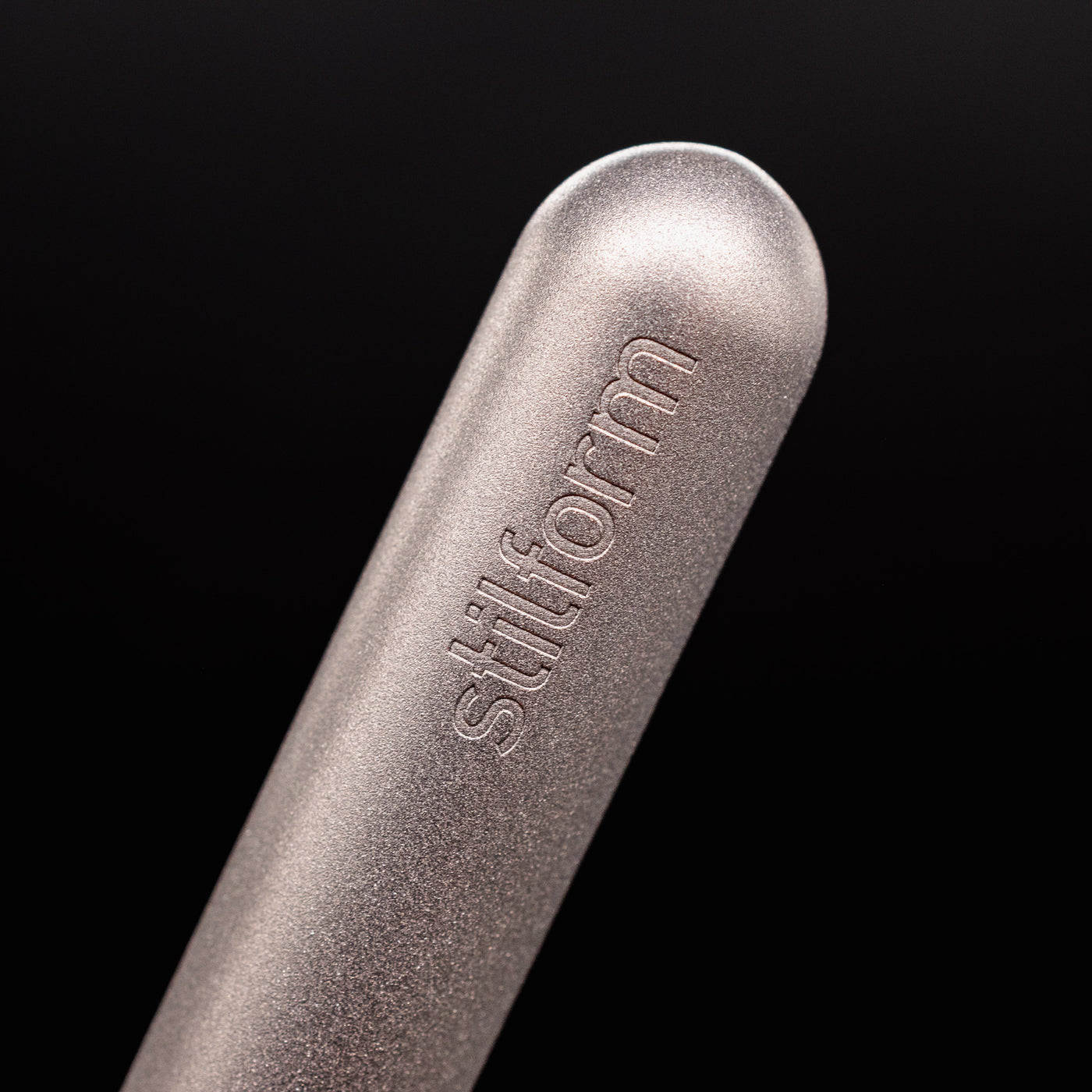 Stilform PEN Ballpoint Pen Titanium Matte - closeup of Stilform logo on barrel