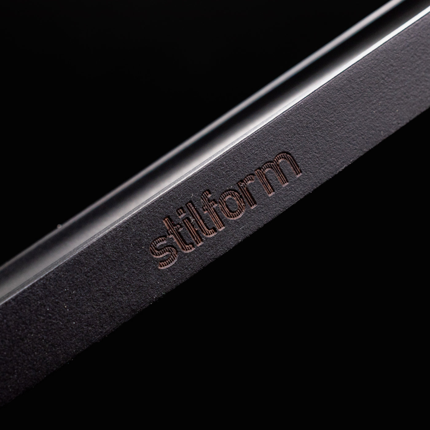 Stilform Wooden Pen Holder Ebony - closeup of Stilform logo