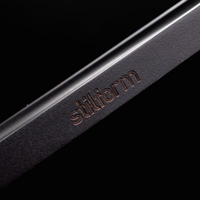 Stilform Wooden Pen Holder Ebony - closeup of Stilform logo