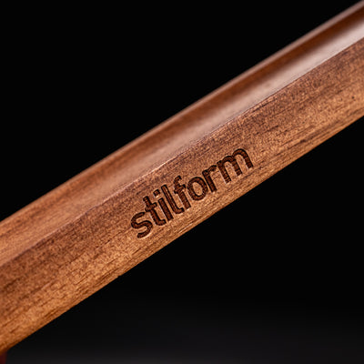 Stilform Wooden Pen Holder Walnut - closeup of Stilform logo