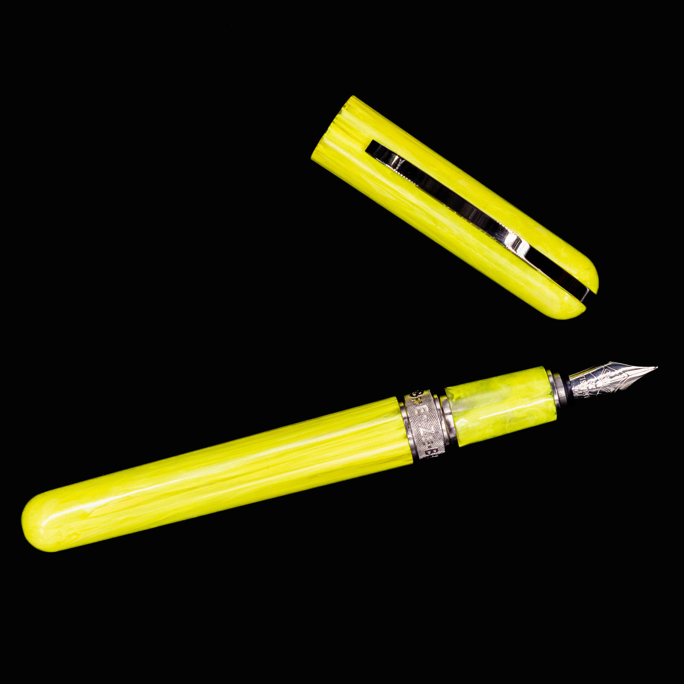 Flat lay of uncapped Visconti Breeze Fountain Pen in Lemon with visible nib and section