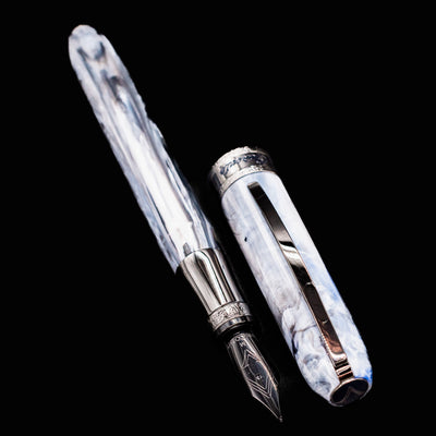 Visconti Comedia Caronte Fountain Pen opened with cap and barrel side by side on dark background.