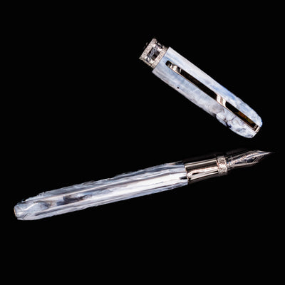 Flat lay of Visconti Comedia Caronte Fountain Pen with cap removed and placed above the barrel.