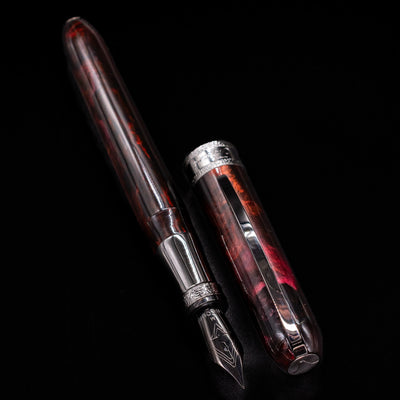 Visconti Comedia Inferno Fountain Pen with detailed view of cap and shimmering resin body