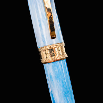 Detail of Visconti Comedia Paradiso cap band engraved with Paradiso in script and gold trim.