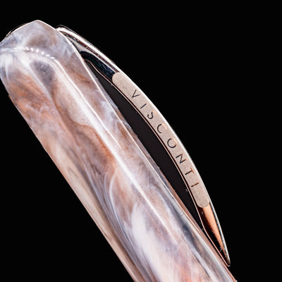 Macro shot of Visconti Comedia Purgatorio fountain pen clip with Visconti logo engraving