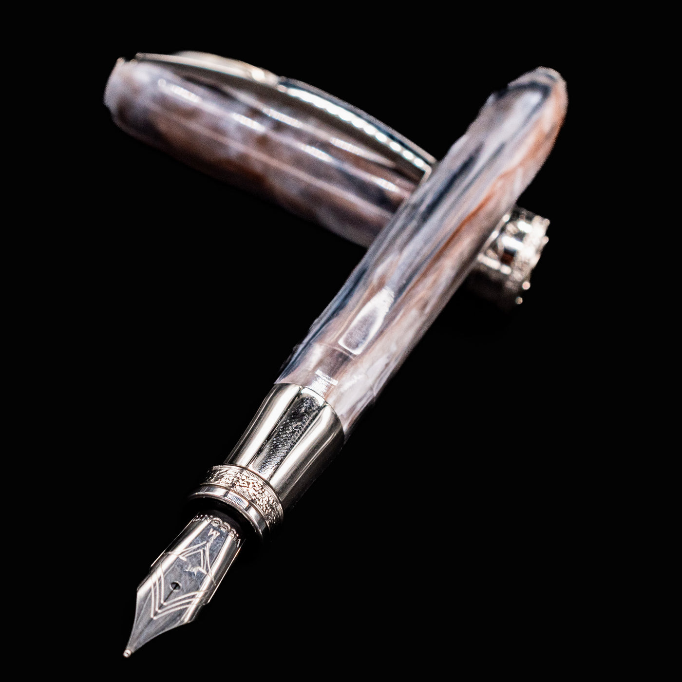Close-up of Visconti Comedia Purgatorio fountain pen nib and marbled resin barrel