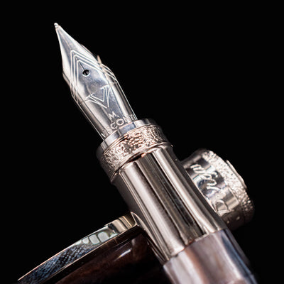 Detailed macro view of Visconti Comedia Purgatorio medium nib with engraved Visconti logo
