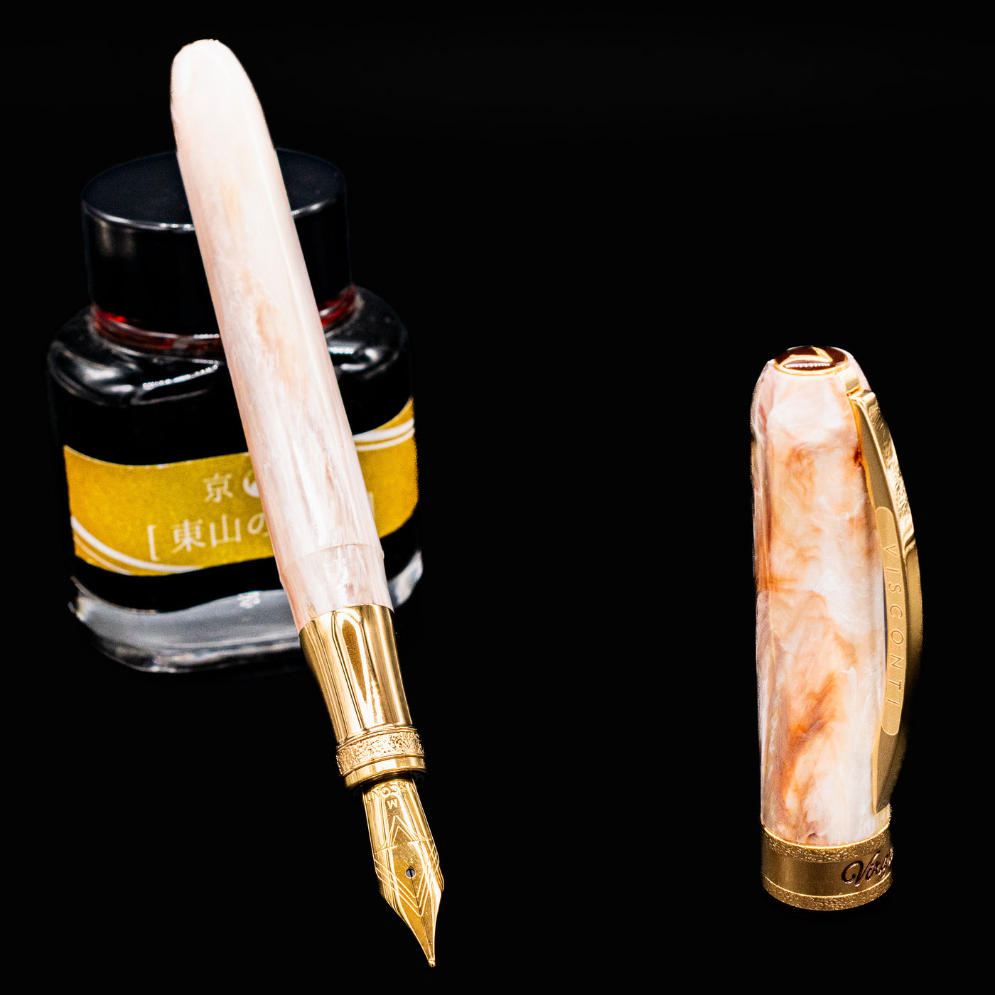 Visconti Comedia Virgilio Fountain Pen nib close-up with ink bottle background