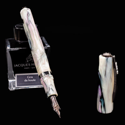 Visconti Divina Abalone Serial #1 Fountain Pen uncapped next to Jacques Herbin ink