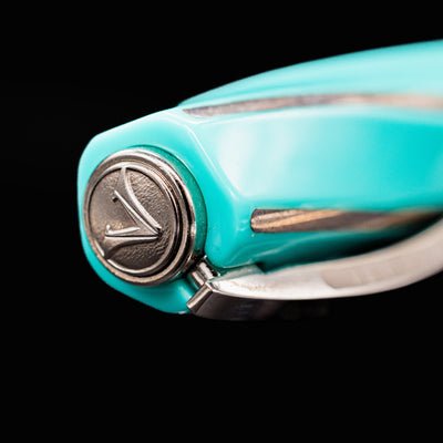Close-up of Visconti Divina Elegance Wave Fountain Pen cap finial with Visconti logo