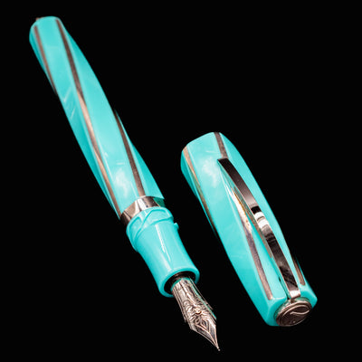 Visconti Divina Elegance Wave Fountain Pen disassembled with cap beside the nib