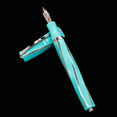 Overhead view of Visconti Divina Elegance Wave Fountain Pen with cap and body crossed