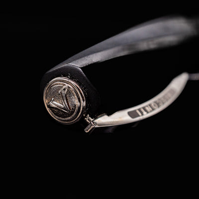 Close-up of Visconti Divina Matte Black Fountain Pen cap finial featuring raised V logo