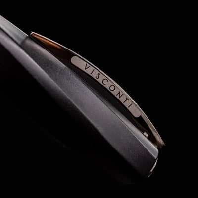 Macro detail of Visconti Divina Matte Black Fountain Pen chrome-plated clip engraved with VISCONTI branding