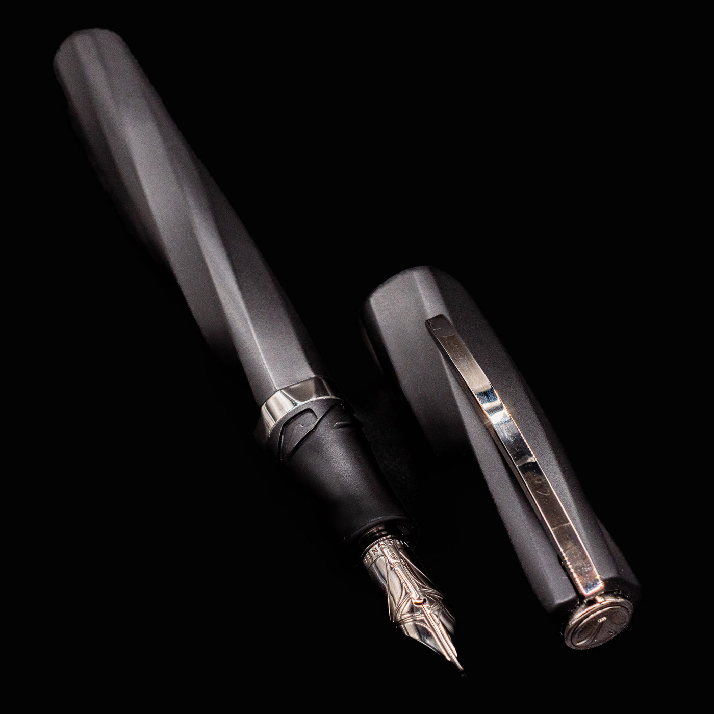 Diagonal layout of Visconti Divina Matte Black Fountain Pen with cap and polished trim accents
