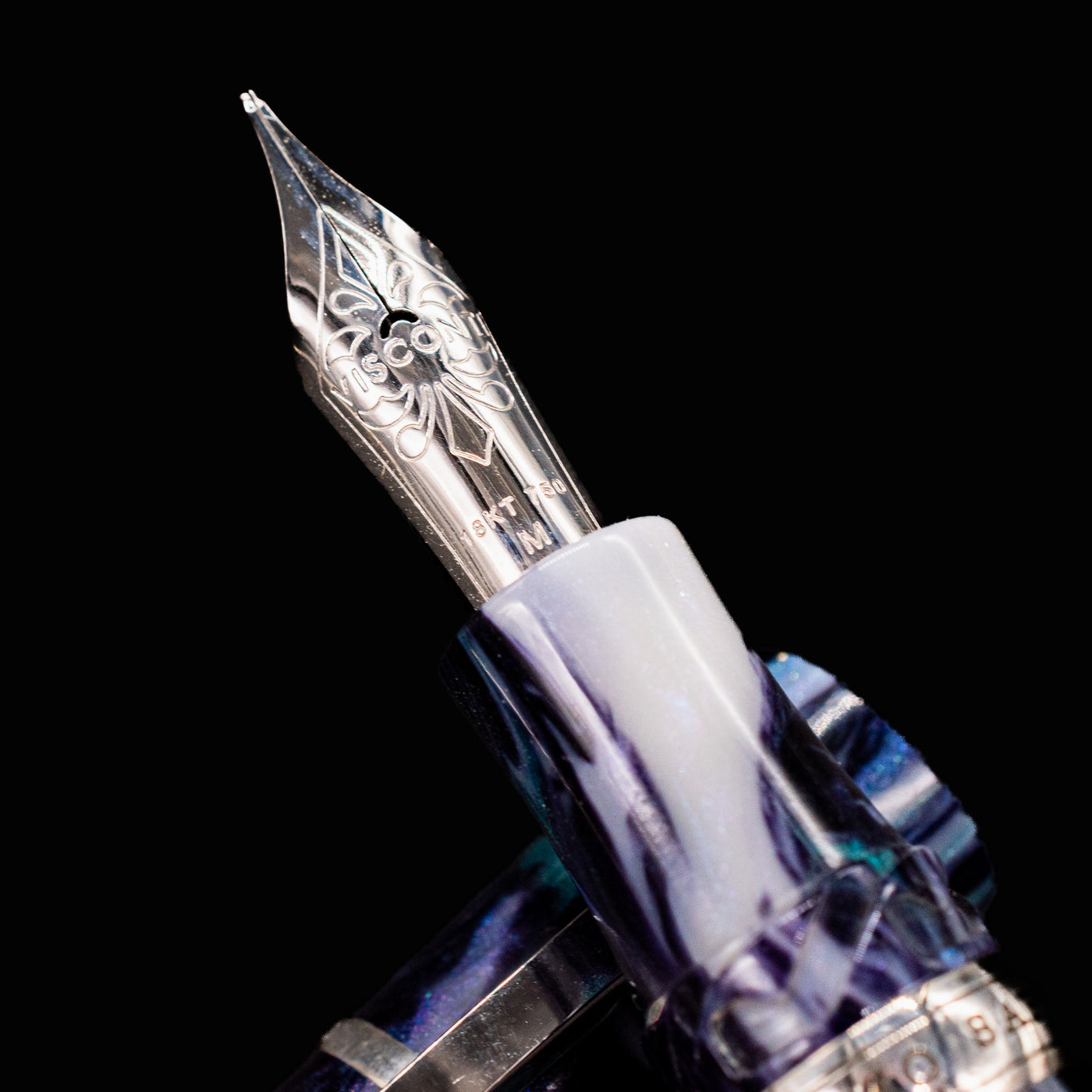 Close-up of Visconti Homo Sapiens Air fountain pen 18k gold nib with engraved floral design