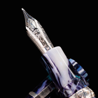 Close-up of Visconti Homo Sapiens Air fountain pen 18k gold nib with engraved floral design