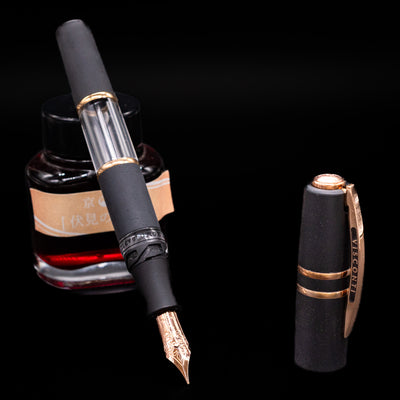 Visconti Homo Sapiens Crystal Dream Fountain pen with ink bottle on a black background