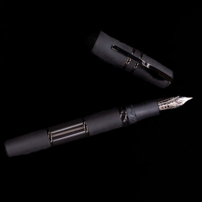 Visconti Homo Sapiens fountain pen with black body and black PVD accents on a black background