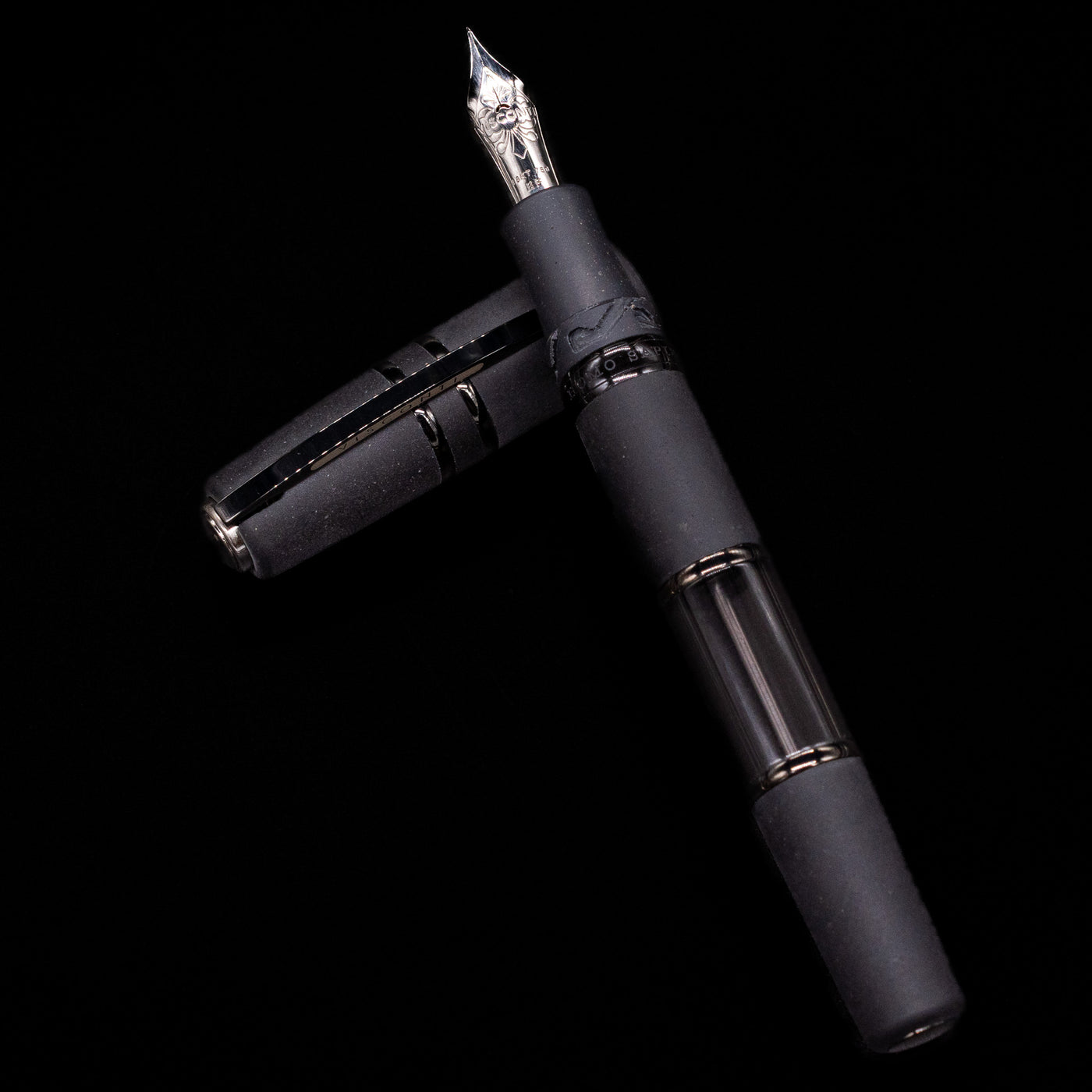 Visconti Homo Sapiens fountain pen with a black body and black PVD accents on a black background