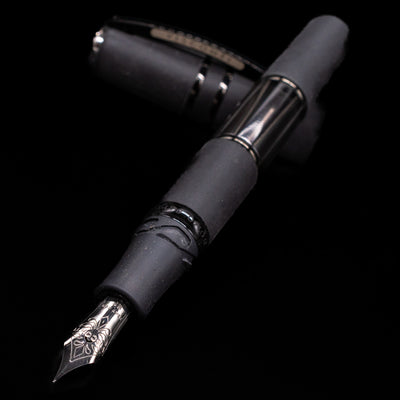 Black lava Visconti fountain pen with decorative nib on a black background