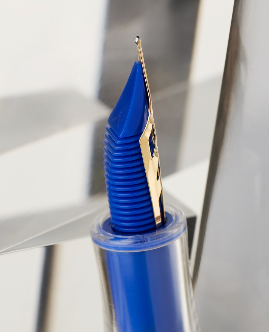 Visconti Homo Sapiens Full Demo Fountain Pen revealing blue feed under 14k gold nib