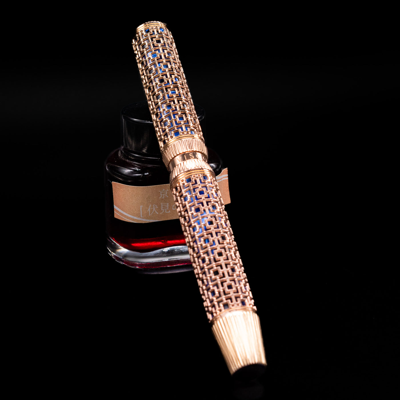 Angled view of Visconti Looking East Fountain Pen featuring pearlescent blue resin and rose gold vermeil filigree capped