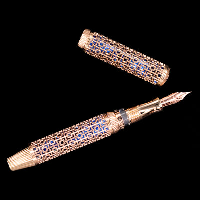 Visconti Looking East Fountain Pen capped and standing, emphasizing filigree pattern and rose gold accents