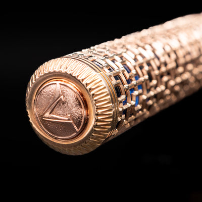 Detailed closeup of Visconti Looking East Fountain Pen’s logo on the cap
