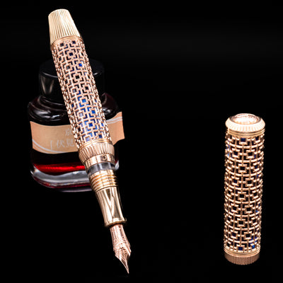Uncapped Visconti Looking East Fountain Pen with visible 18k gold nib and detailed filigree overlay