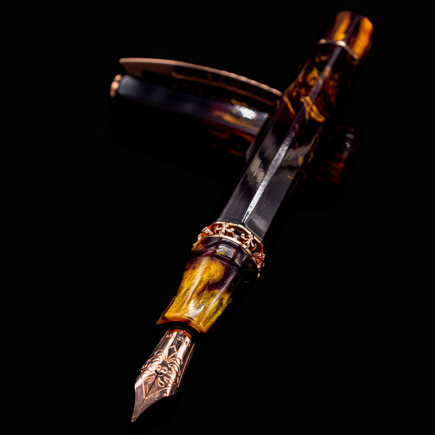 Close-up of Visconti Medici Palazzo Pitti Fountain Pen nib and section with amber and burgundy resin swirls