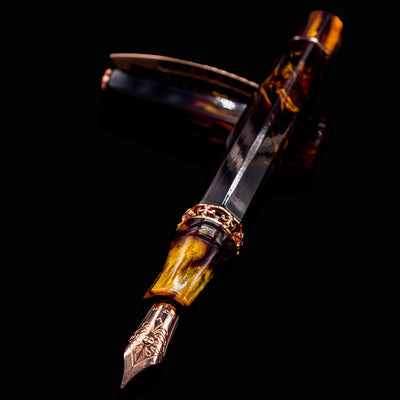Close-up of Visconti Medici Palazzo Pitti Fountain Pen nib and section with amber and burgundy resin swirls