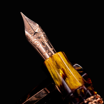 Macro photo of Visconti 18k rose gold nib on Medici Palazzo Pitti Fountain Pen with intricate engraving
