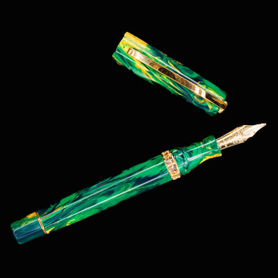 Overhead flatlay of Visconti Medici Palazzo Riccardi fountain pen and cap on black background