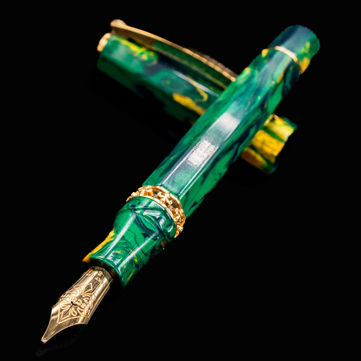 Close-up of Visconti Medici Palazzo Riccardi fountain pen nib and marbled green resin body