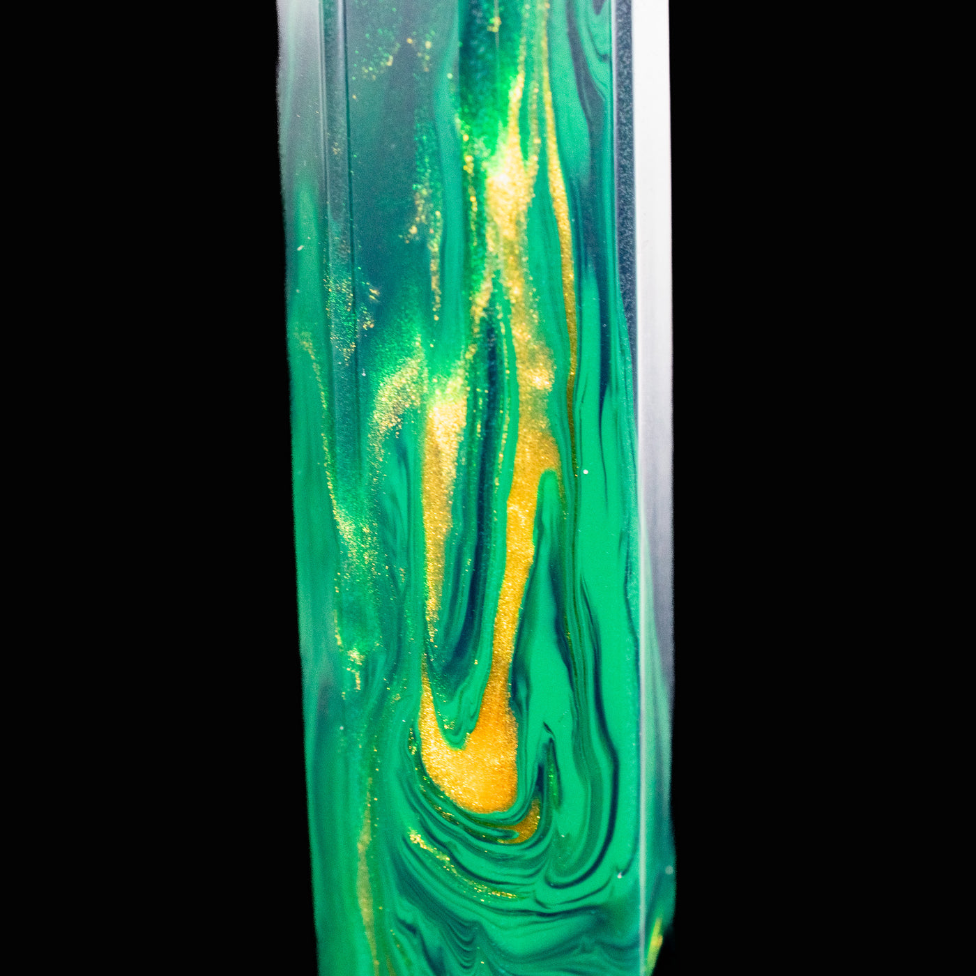 Close-up of shimmering green and gold resin pattern on the Visconti Medici Palazzo Riccardi fountain pen barrel