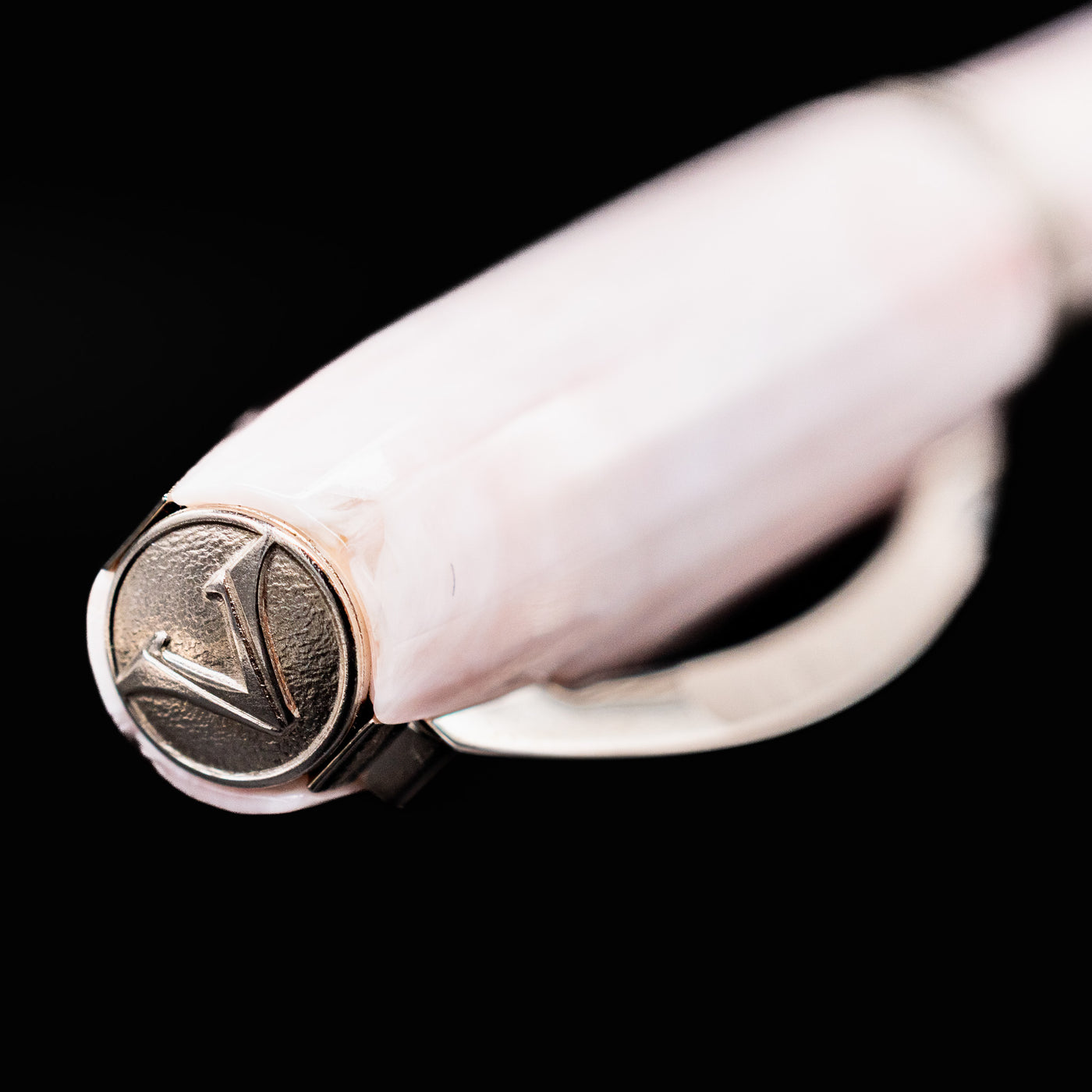 Visconti Michelangelo Venus Rose Fountain Pen cap finial with engraved Visconti “V” emblem