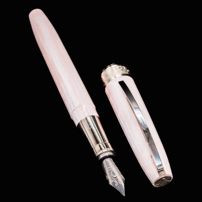 Visconti Michelangelo Venus Rose Fountain Pen displayed with cap removed, showing gleaming nib and grip