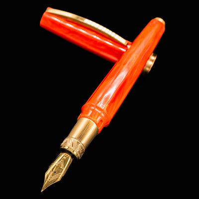 Angled view of Visconti Mirage Mythos Demeter Fountain Pen uncapped, highlighting the bronze nib and engraved grip section