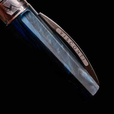 Close-up of the Visconti Mirage Mythos Poseidon Fountain Pen cap featuring the Visconti clip logo
