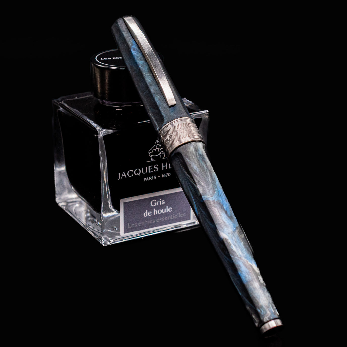 Visconti Mirage Mythos Poseidon Fountain Pen displayed with Jacques Herbin Gris de Houle ink bottle