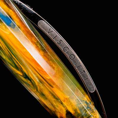 Macro detail of Visconti Van Gogh Café Terrace at Night pen clip with engraved branding