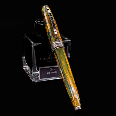 Visconti Van Gogh Café Terrace at Night fountain pen resting on Jacques Herbin Gris de Houle ink bottle