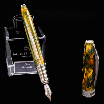 Uncapped Visconti Van Gogh Café Terrace at Night fountain pen with ink bottle in background