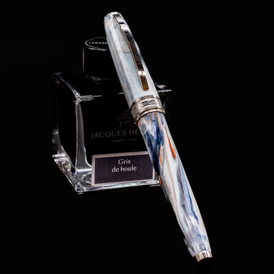 Visconti Van Gogh Old Vineyard with Peasant Woman Fountain Pen resting on Jacques Herbin ink bottle