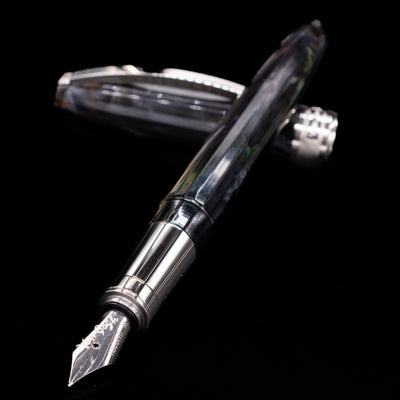 Angled shot of Visconti Van Gogh The Potato Eaters Fountain Pen showing stainless steel nib and colorful barrel