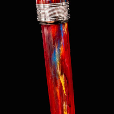 Detail view of Visconti Van Gogh Red Vineyard Fountain Pen resin barrel showing swirling red, blue, and yellow marbled acrylic