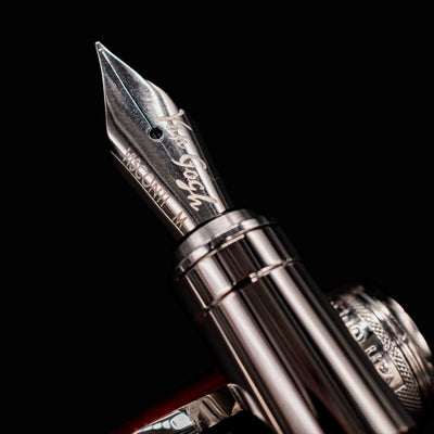 Macro shot of Visconti Van Gogh Red Vineyard Fountain Pen nib engraved with Van Gogh branding and medium nib size
