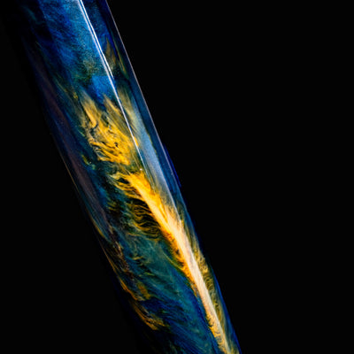 Extreme close-up of Visconti Van Gogh Starry Night pen barrel, highlighting vibrant yellow and blue swirling resin.